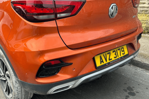 MG ZS 2021-2024 REAR BUMPER COVER PANEL WITH DIFFUSER REFLECTORS IN ORANGE - Image 2