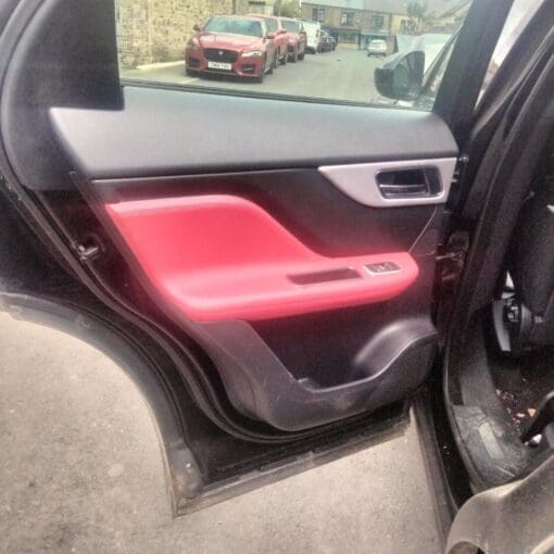 JAGUAR F PACE R SPORT 2018-2022 PASSENGER SIDE REAR LEATHER  DOOR CARD IN RED