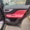JAGUAR F PACE R SPORT 2018-2022 DRIVER SIDE REAR LEATHER  DOOR CARD IN RED